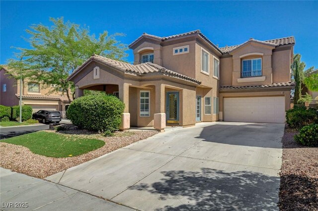 5931 Allanche Ave, Las Vegas, NV 89141 - view of front of home with a tile roof, stucco siding, an attached garage, and driveway