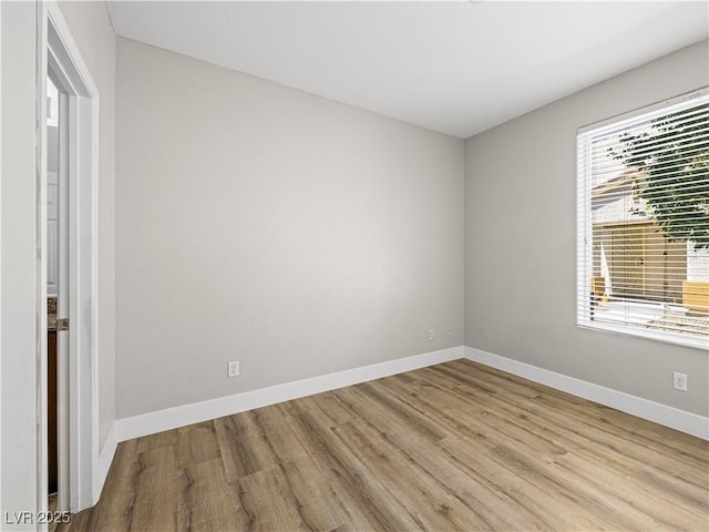 4563 Townwall St, Las Vegas, NV 89115 - spare room with wood finished floors and baseboards