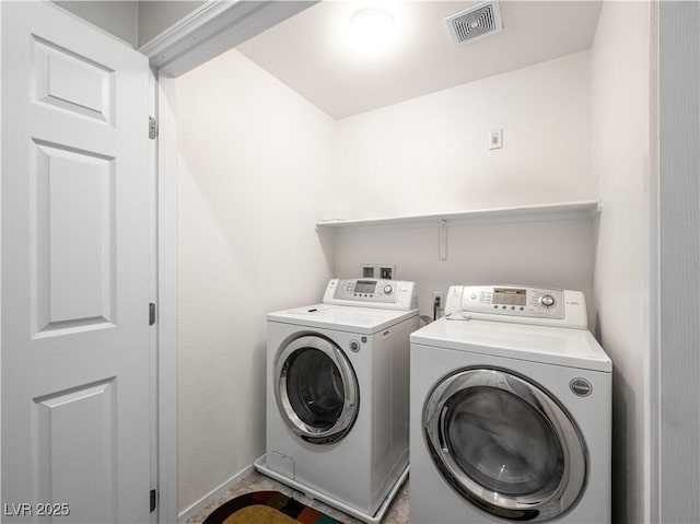 4563 Townwall St, Las Vegas, NV 89115 - laundry area with independent washer and dryer and baseboards