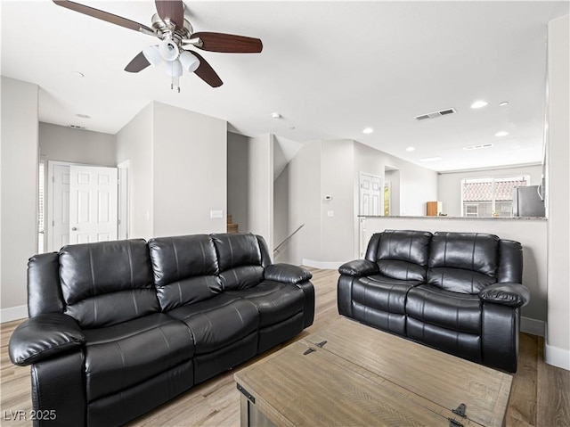4563 Townwall St, Las Vegas, NV 89115 - living room featuring light wood-style floors, baseboards, a ceiling fan, and recessed lighting