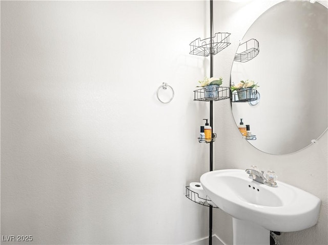 4563 Townwall St, Las Vegas, NV 89115 - bathroom with baseboards and a sink