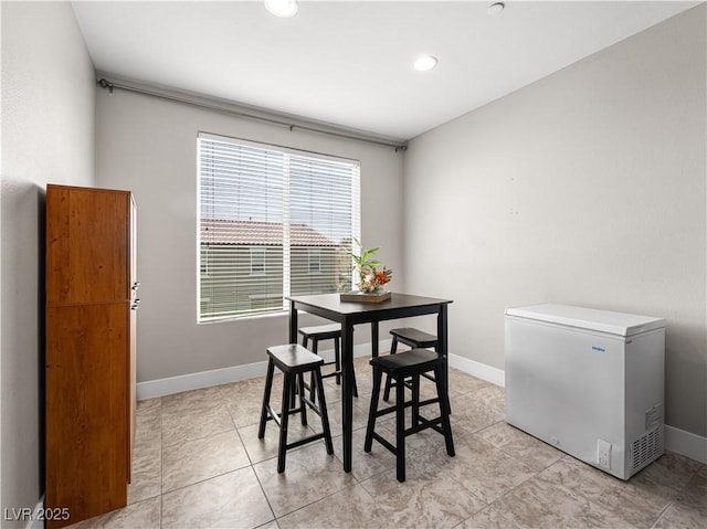 4563 Townwall St, Las Vegas, NV 89115 - dining room with baseboards, light tile patterned floors, and recessed lighting