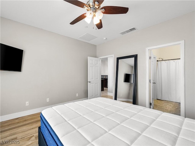 4563 Townwall St, Las Vegas, NV 89115 - bedroom with light wood-style floors, baseboards, and ceiling fan