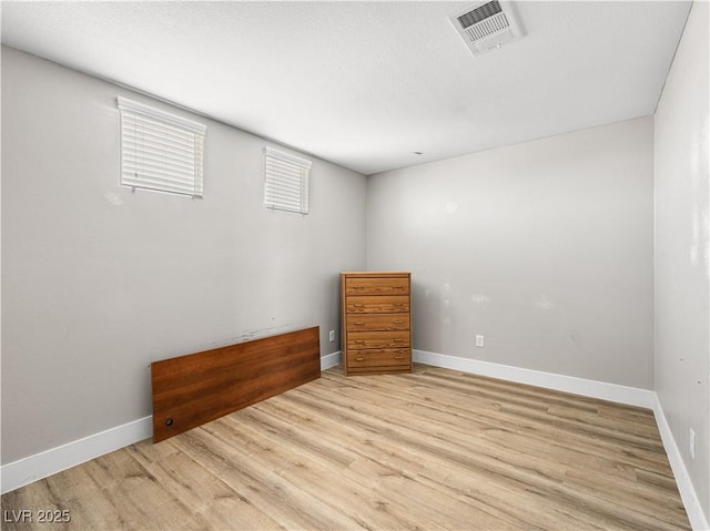 4563 Townwall St, Las Vegas, NV 89115 - unfurnished bedroom featuring light wood-style flooring and baseboards