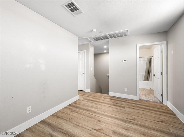 4563 Townwall St, Las Vegas, NV 89115 - spare room featuring baseboards, wood finished floors, and a smoke detector