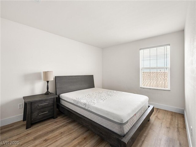 4563 Townwall St, Las Vegas, NV 89115 - bedroom featuring wood finished floors and baseboards