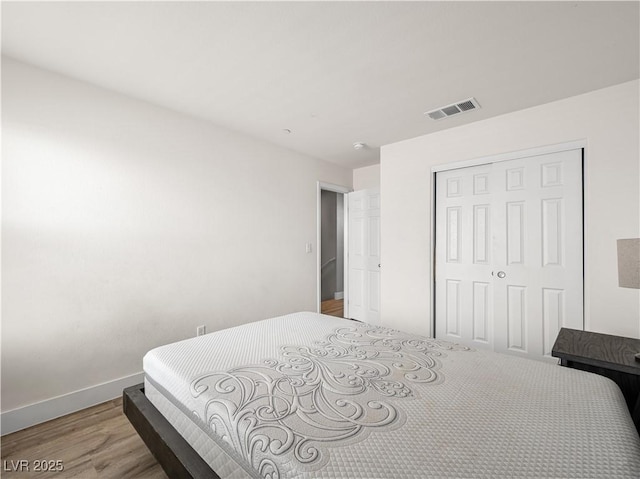 4563 Townwall St, Las Vegas, NV 89115 - bedroom featuring light wood-style flooring, baseboards, and a closet