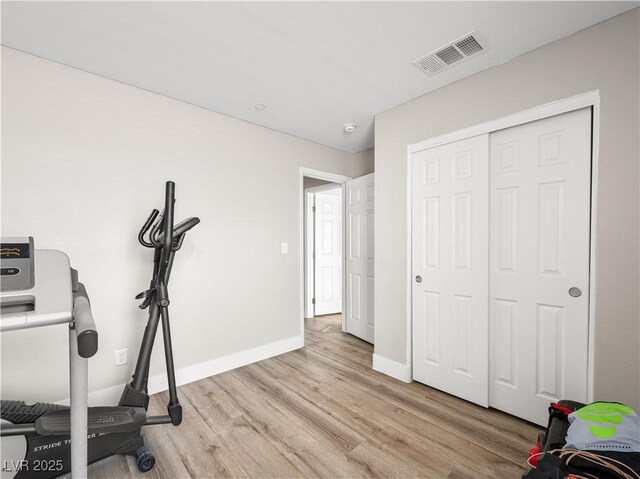 4563 Townwall St, Las Vegas, NV 89115 - workout area with wood finished floors and baseboards