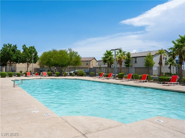 4563 Townwall St, Las Vegas, NV 89115 - community pool featuring a patio and a residential view