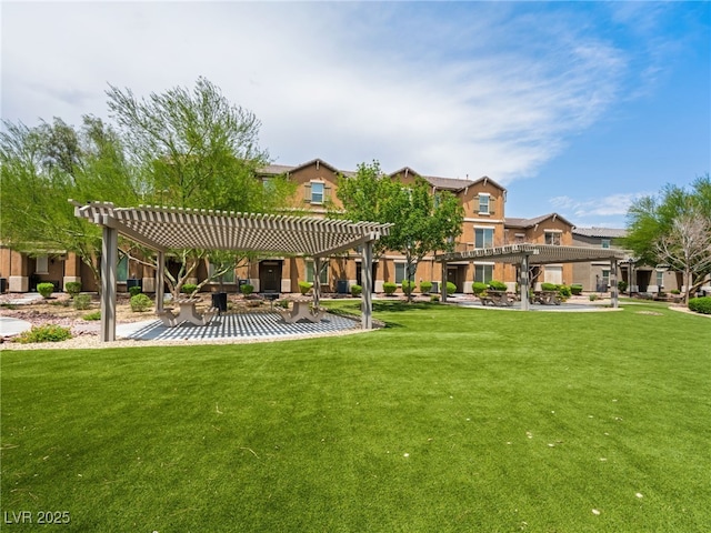 4563 Townwall St, Las Vegas, NV 89115 - view of community featuring a pergola, a yard, and a patio