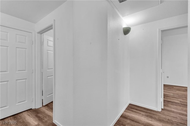 1300 S Arlington St Unit 120, Las Vegas, NV 89104 - hall with wood finished floors, attic access, and baseboards