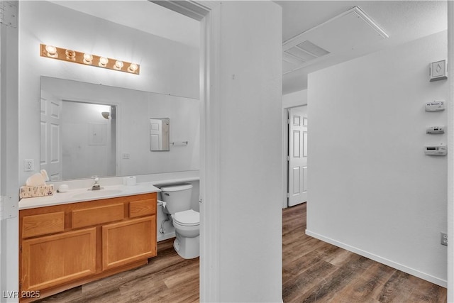 1300 S Arlington St Unit 120, Las Vegas, NV 89104 - bathroom with wood finished floors, vanity, and toilet