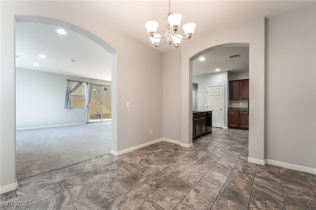 10917 Mount Pendleton St, Las Vegas, NV 89179 - unfurnished room with arched walkways, a chandelier, baseboards, and recessed lighting