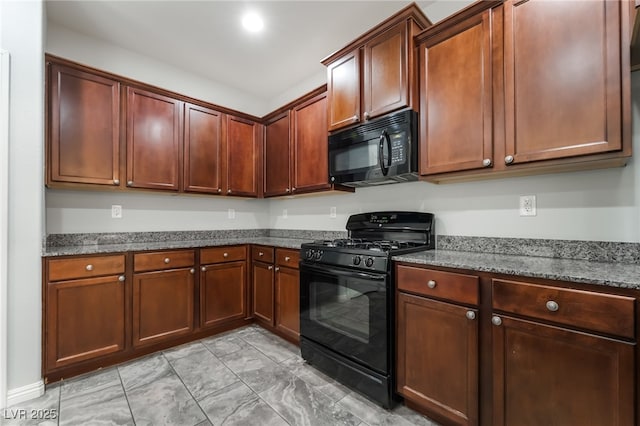 10917 Mount Pendleton St, Las Vegas, NV 89179 - kitchen featuring black appliances, dark stone counters, and light marble finish floors