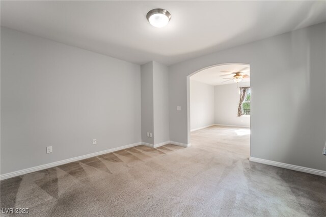 10917 Mount Pendleton St, Las Vegas, NV 89179 - unfurnished room featuring arched walkways, carpet flooring, baseboards, and ceiling fan