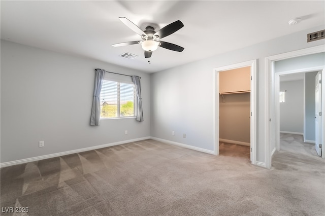 10917 Mount Pendleton St, Las Vegas, NV 89179 - unfurnished bedroom with carpet, baseboards, and a walk in closet