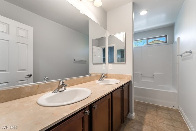 10917 Mount Pendleton St, Las Vegas, NV 89179 - full bathroom with double vanity, tub / shower combination, and baseboards