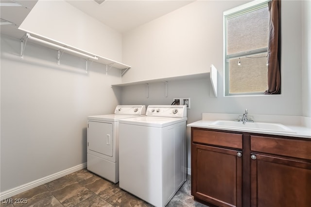 10917 Mount Pendleton St, Las Vegas, NV 89179 - laundry room featuring washer and dryer, baseboards, and cabinet space