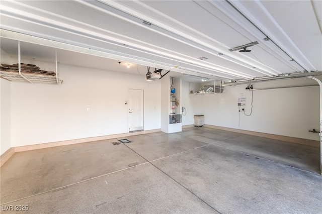 10917 Mount Pendleton St, Las Vegas, NV 89179 - garage with a garage door opener and baseboards