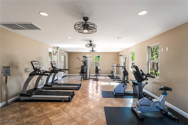 10917 Mount Pendleton St, Las Vegas, NV 89179 - workout area featuring plenty of natural light, recessed lighting, baseboards, and light tile patterned floors