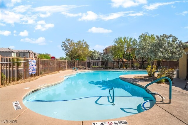 10917 Mount Pendleton St, Las Vegas, NV 89179 - community pool featuring a patio