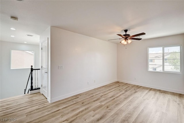 7372 S Palo Real Ct, Las Vegas, NV 89179 - spare room with light wood-style flooring, ceiling fan, and a smoke detector