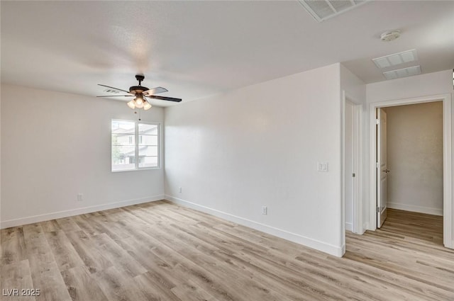 7372 S Palo Real Ct, Las Vegas, NV 89179 - empty room featuring a smoke detector, ceiling fan, and light wood-style flooring