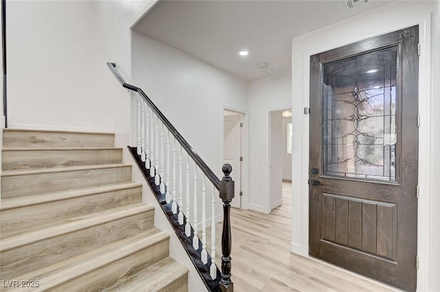 7372 S Palo Real Ct, Las Vegas, NV 89179 - entrance foyer with light wood finished floors, stairway, and recessed lighting