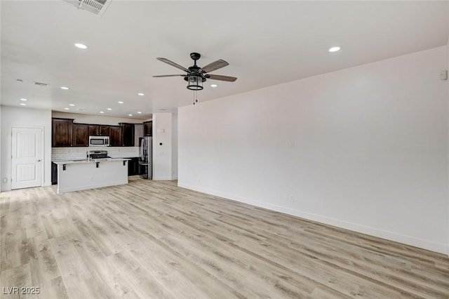 7372 S Palo Real Ct, Las Vegas, NV 89179 - unfurnished living room with recessed lighting, light wood-style floors, and ceiling fan