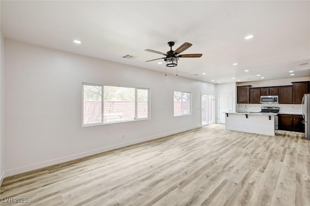 7372 S Palo Real Ct, Las Vegas, NV 89179 - unfurnished living room with recessed lighting, light wood-style flooring, and a ceiling fan
