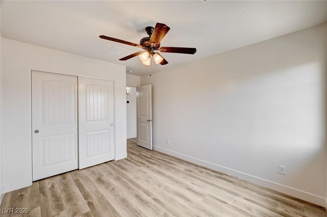 7372 S Palo Real Ct, Las Vegas, NV 89179 - unfurnished bedroom featuring light wood-style floors, a closet, and a ceiling fan