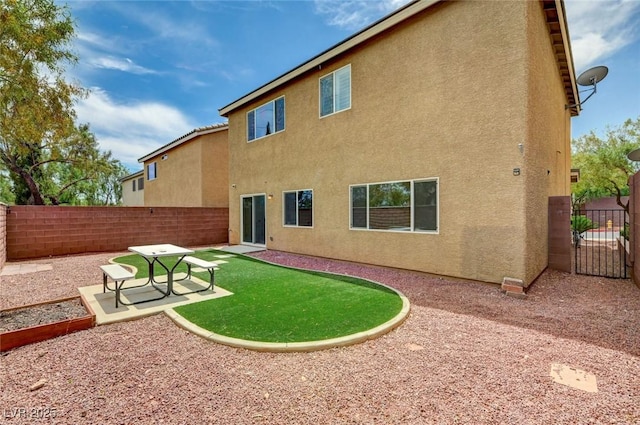 7372 S Palo Real Ct, Las Vegas, NV 89179 - rear view of house with stucco siding, a patio area, and a fenced backyard