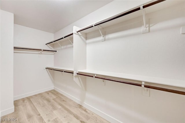 7372 S Palo Real Ct, Las Vegas, NV 89179 - spacious closet featuring light wood-style floors