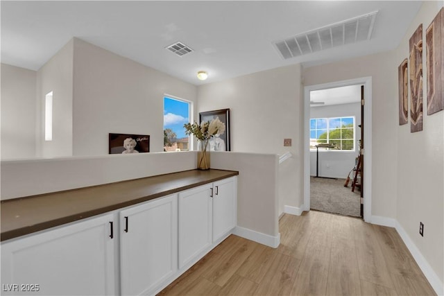 6108 Shallow Springs St, Las Vegas, NV 89130 - hall featuring light wood-style flooring and baseboards