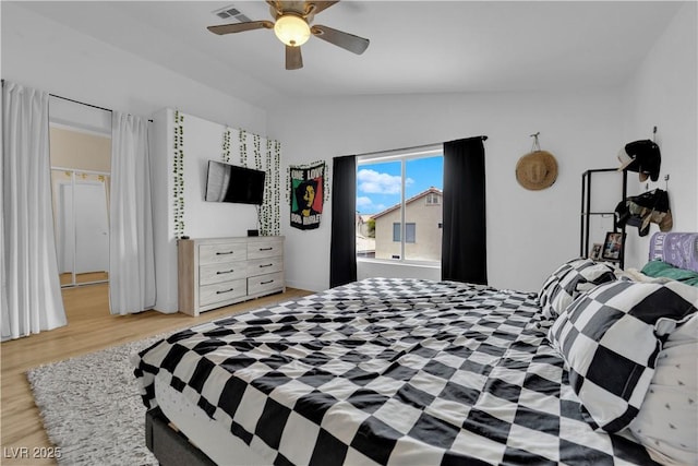 6108 Shallow Springs St, Las Vegas, NV 89130 - bedroom featuring lofted ceiling, light wood-style flooring, and a ceiling fan