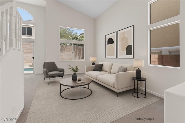 10680 Sapphire Vista Ave, Las Vegas, NV 89144 - living area featuring baseboards, high vaulted ceiling, and carpet