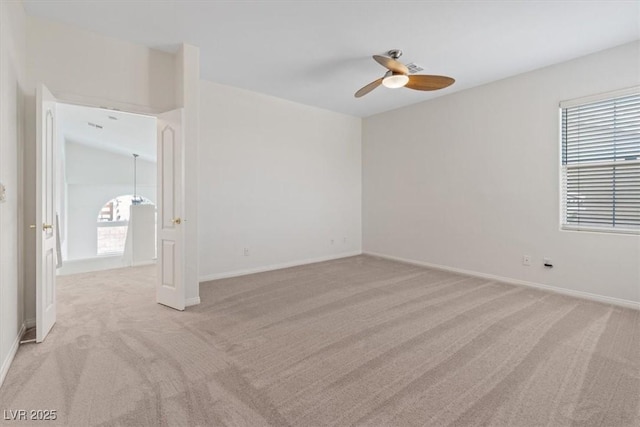 10680 Sapphire Vista Ave, Las Vegas, NV 89144 - unfurnished room with light carpet, a ceiling fan, healthy amount of natural light, and baseboards