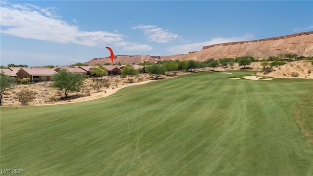 1407 Wheelwright Ct, Mesquite, NV 89034 - view of property's community featuring view of golf course, a mountain view, and a lawn