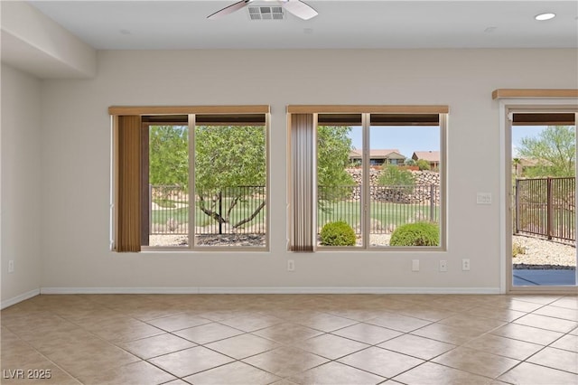 1407 Wheelwright Ct, Mesquite, NV 89034 - spare room with plenty of natural light, light tile patterned floors, a ceiling fan, and baseboards