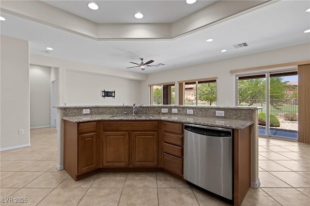1407 Wheelwright Ct, Mesquite, NV 89034 - kitchen featuring dishwasher, a sink, light tile patterned floors, light stone counters, and a ceiling fan