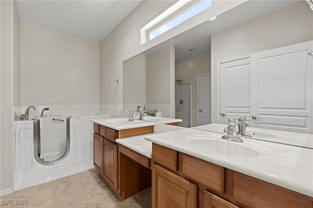 1407 Wheelwright Ct, Mesquite, NV 89034 - full bathroom with tile patterned floors, vanity, a garden tub, and a walk in shower
