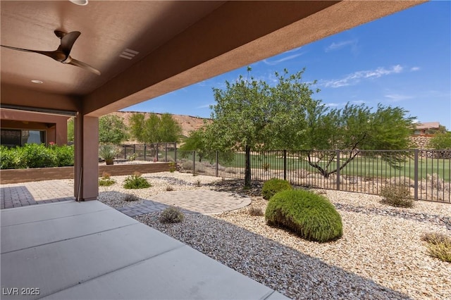 1407 Wheelwright Ct, Mesquite, NV 89034 - fenced backyard featuring ceiling fan and a patio