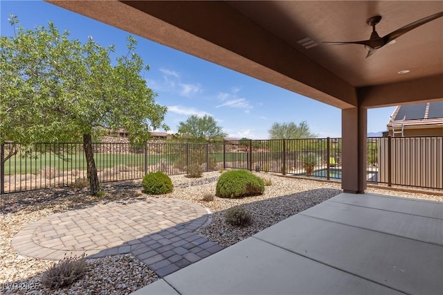 1407 Wheelwright Ct, Mesquite, NV 89034 - fenced backyard featuring a ceiling fan and a patio