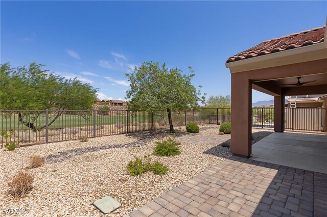 1407 Wheelwright Ct, Mesquite, NV 89034 - fenced backyard featuring a patio and a ceiling fan