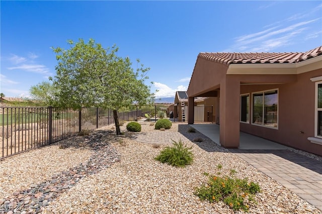 1407 Wheelwright Ct, Mesquite, NV 89034 - fenced backyard with a patio area