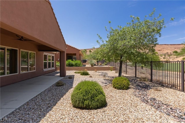 1407 Wheelwright Ct, Mesquite, NV 89034 - fenced backyard with a patio area and ceiling fan