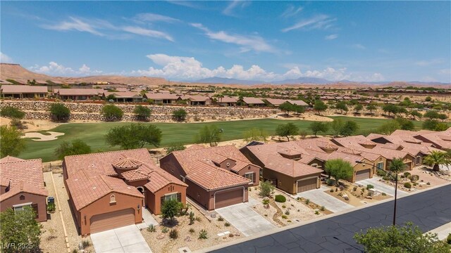 1407 Wheelwright Ct, Mesquite, NV 89034 - aerial perspective of suburban area with a mountainous background and a golf club