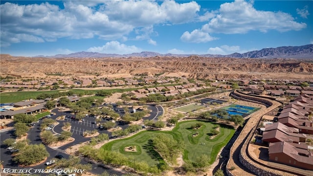 1407 Wheelwright Ct, Mesquite, NV 89034 - aerial view of residential area featuring a mountain backdrop and a golf course
