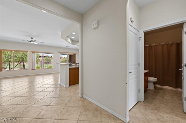 1407 Wheelwright Ct, Mesquite, NV 89034 - hallway with light tile patterned floors, baseboards, and recessed lighting