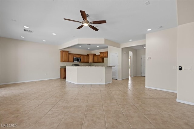1407 Wheelwright Ct, Mesquite, NV 89034 - unfurnished living room with ceiling fan, light tile patterned floors, baseboards, and recessed lighting